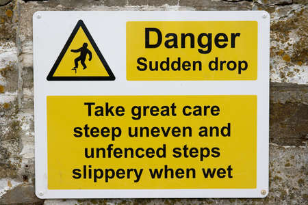 Warning sign for possibility of fallingの写真素材