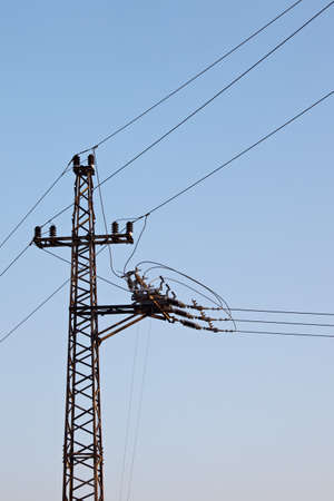 Electric line against clear blue skyの写真素材