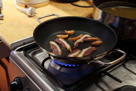 Preparing food on a stoveの写真素材