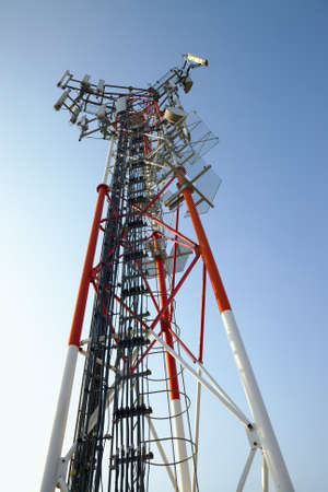 GSM transmitter tower against blue skyの写真素材