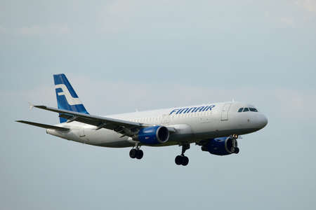 BUDAPEST, HUNGARY - MAY 5: Finnair A320 approaching Budapest Liszt Ferenc Airport, May 5th 2012. Finnair is Finlands flag carrier and largest airline.のeditorial素材
