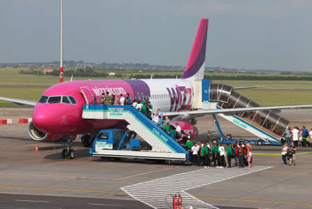BUDAPEST, HUNGARY - MAY 5: Passengers boarding a Wizzair airliner at Budapest Liszt Ferenc Airport, May 5th 2012. Wizzair is a rapidly growing low-cost carrier based in Hungary.のeditorial素材