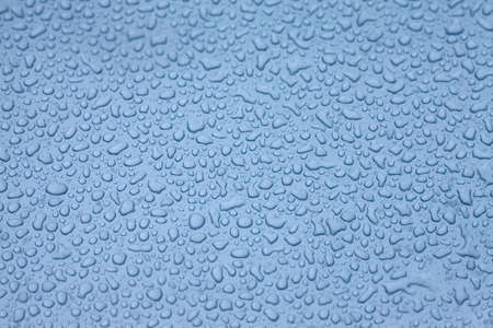 Raindrops on a blue surfaceの写真素材