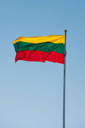 Lithuanian flag against blue skyの写真素材