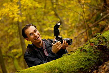 Happy photographer in a forestの写真素材