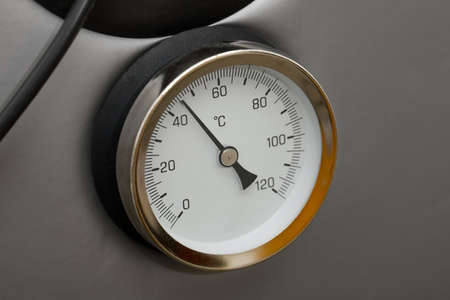 Thermometer on a hot water containerの写真素材