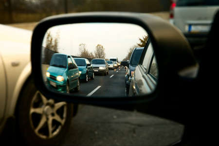 Traffic jam in the sideview mirror of a carの写真素材