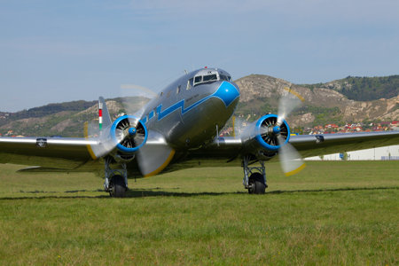 BUDAORS, HUNGARY - APRIL 21: Li-2 Aircraft ready to take off, April 21th 2013. This plane was made...