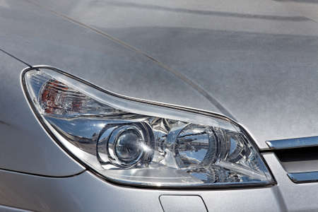 Closeup of the headlights of a carの写真素材