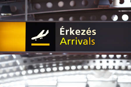 Arrivals airport sign in Hungary with Hungarian textのeditorial素材