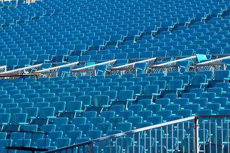 Rows of empty chairs of a stadiumの写真素材