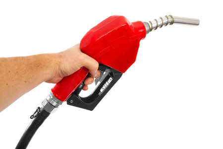 Holding a fuel nozzle against white backgroundの写真素材