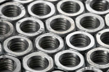Array of metal nuts in black and whiteの写真素材