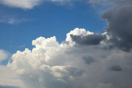 Stormy clouds in the blue skyの写真素材