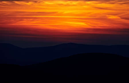 Sunset landscape, sky and mountainsの写真素材