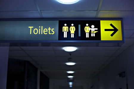 Toilets sign in a building corridorの写真素材