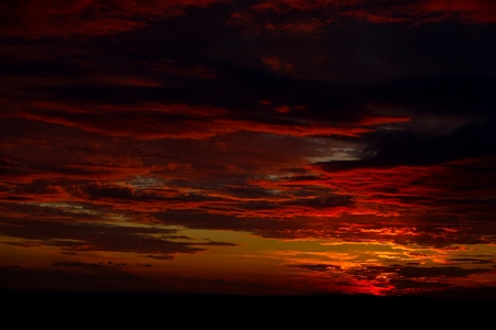 Sunset sky with dark cloudsの写真素材