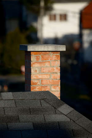 Chimney on a roof oh a houseの写真素材