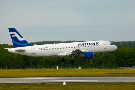 BUDAPEST, HUNGARY - MAY 5: Finnair A320 approaching Budapest Liszt Ferenc Airport, May 5th 2012. Finnair is Finlands flag carrier and largest airline.のeditorial素材