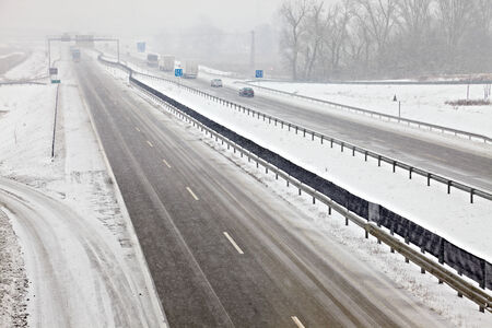 Highway traffic in heavy snowfallの写真素材
