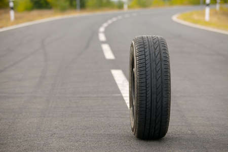 Wheel of a car on a roadの写真素材