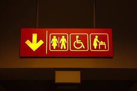 Toilets sign in a building corridorの写真素材