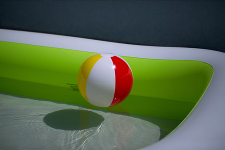 Rubber ball in a swimming poolの写真素材