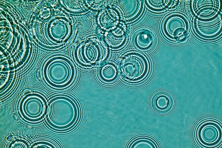 Watter waves by drops hittingの写真素材