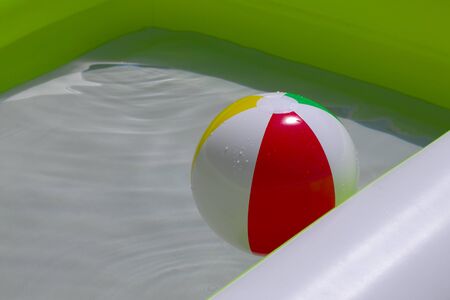 Rubber ball in a swimming poolの写真素材