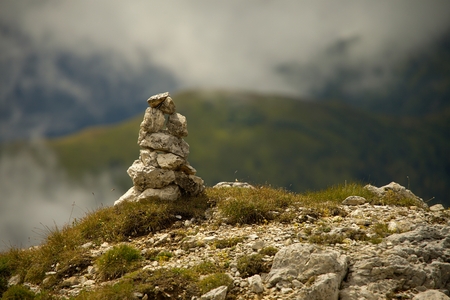 Pile of srones near a mountain pathの写真素材