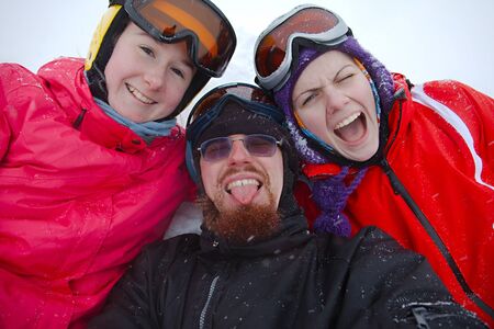 Skiers relaxing in the snowの写真素材