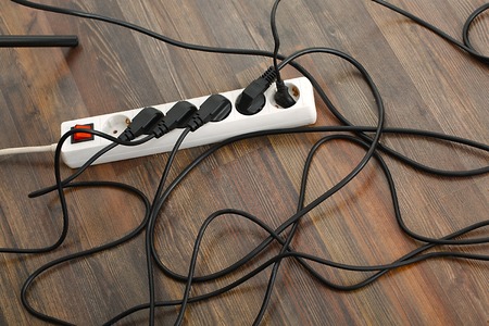 Plugged in electric devices in an extension cordの写真素材