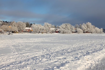 Winter landscape with frozen lakeの写真素材