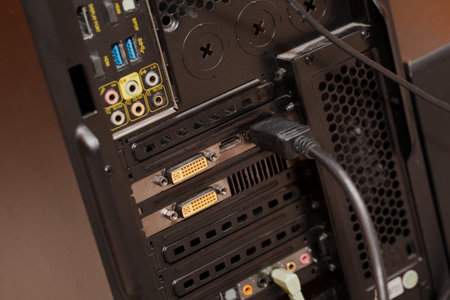 Backside of a computer with cablesの写真素材