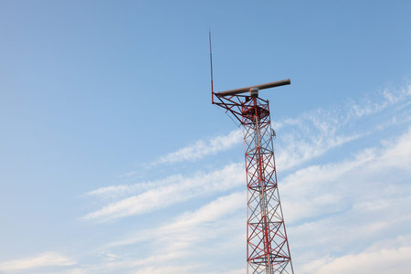 Radar tower against blue sky