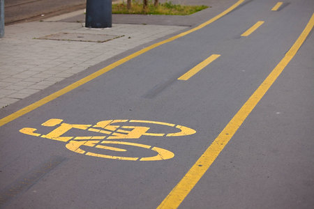 Bicycle lane sign on asphalt surface