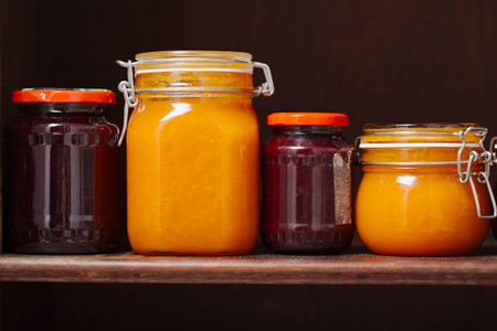 Jars of jam on a shelf