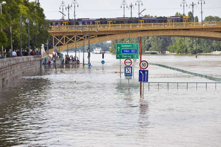 BUDAPEST, HUNGARY - JUNE 6: People at the flooding river Danube, June 6th 2013. Record breaking water level is expected in a few days.のeditorial素材