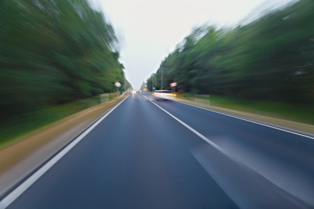 Motion blurred road viewed from a fast car