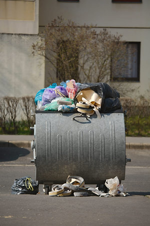 Dumpsters being full with garbage