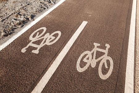 Bicycle lane sign on asphalt surface