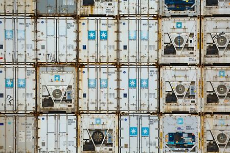 ROTTERDAM, THE NETHERLANDS -  SEPTEMBER 22, 2015: Maersk containers stacked in a shipping terminal. Maersk is the largest container ship operator in the world since 1996.のeditorial素材