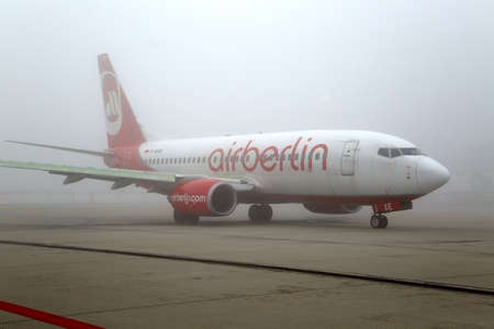BUDAPEST, HUNGARY - DECEMBER 2, 2015: Air Berlin Boeing 737 taxiing at Budapest Liszt Ferenc Airport. Foggy weather with low visibility.のeditorial素材