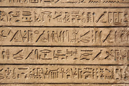 Egiptian hieroglyphs carved in sandstoneの写真素材