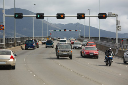 Highway bridge with cars passing by, driving on the left in Tasmania