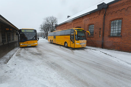 LUND, SWEDEN - DECEMBER 6, 2015: Buses waiting at the station of Lund in snowy winter weather.
