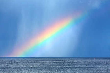 Rainbow over seaの写真素材