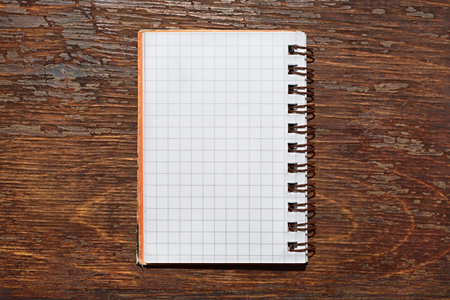 Notebook with square grid on a table