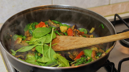 Preparing hot breakfastの写真素材