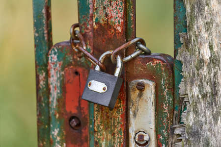 Old gate with padlockの写真素材